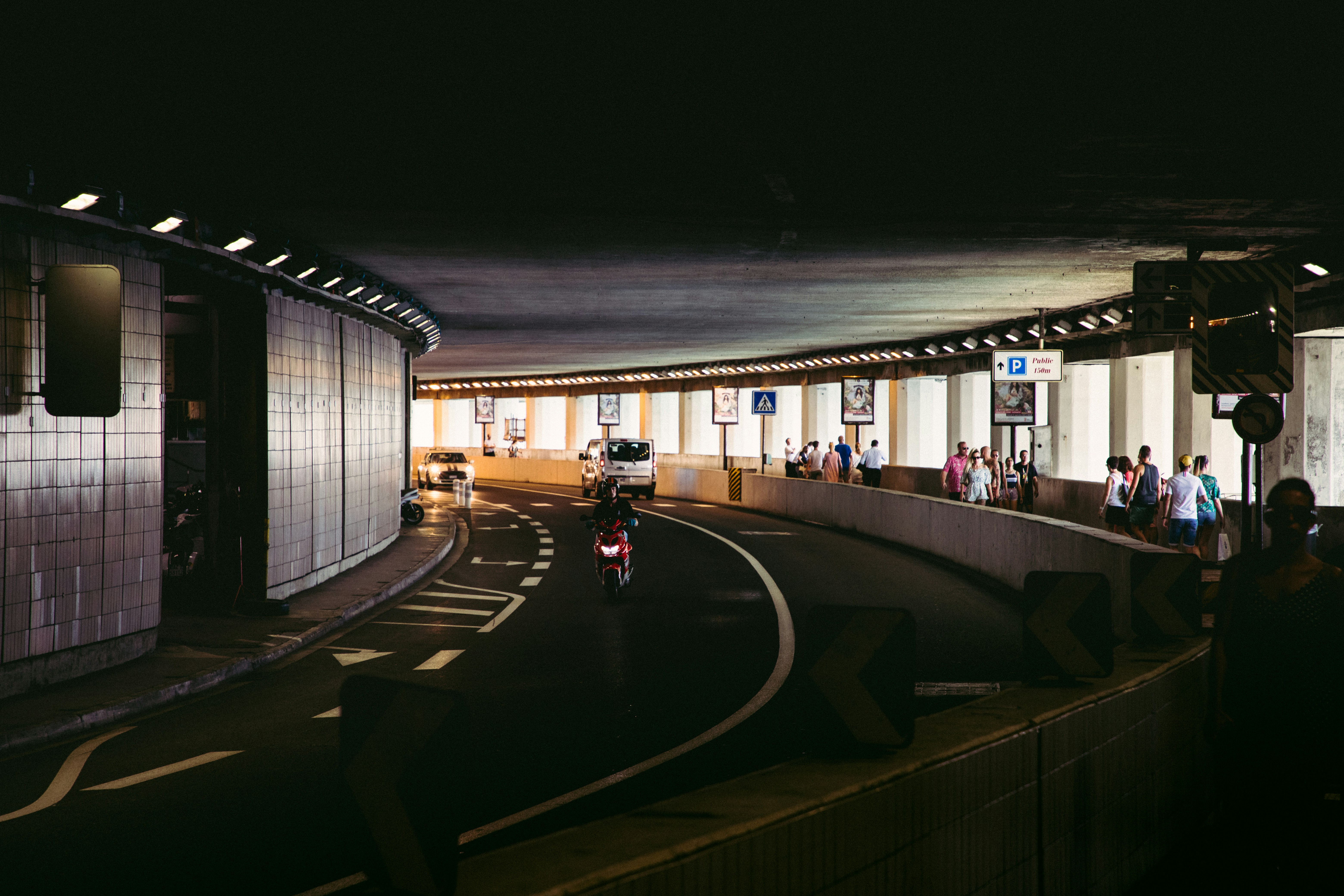 people walking on sidewalk during night time monaco teams background