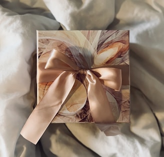 white and brown floral paper on white textile