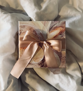 white and brown floral paper on white textile