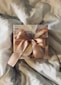 white and brown floral paper on white textile