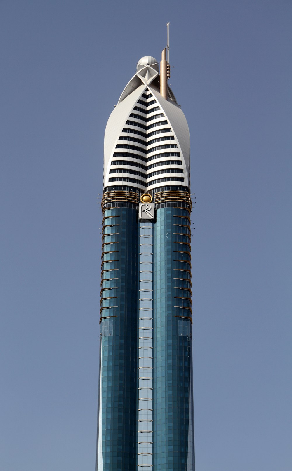 white and blue tower under blue sky during daytime