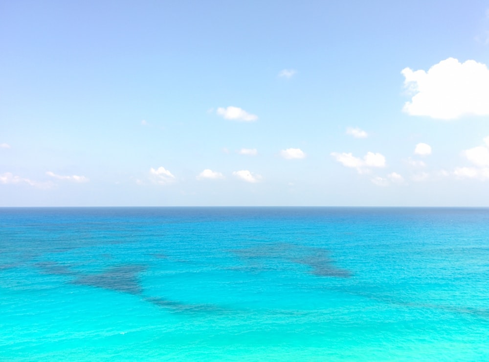 blue sea under blue sky during daytime