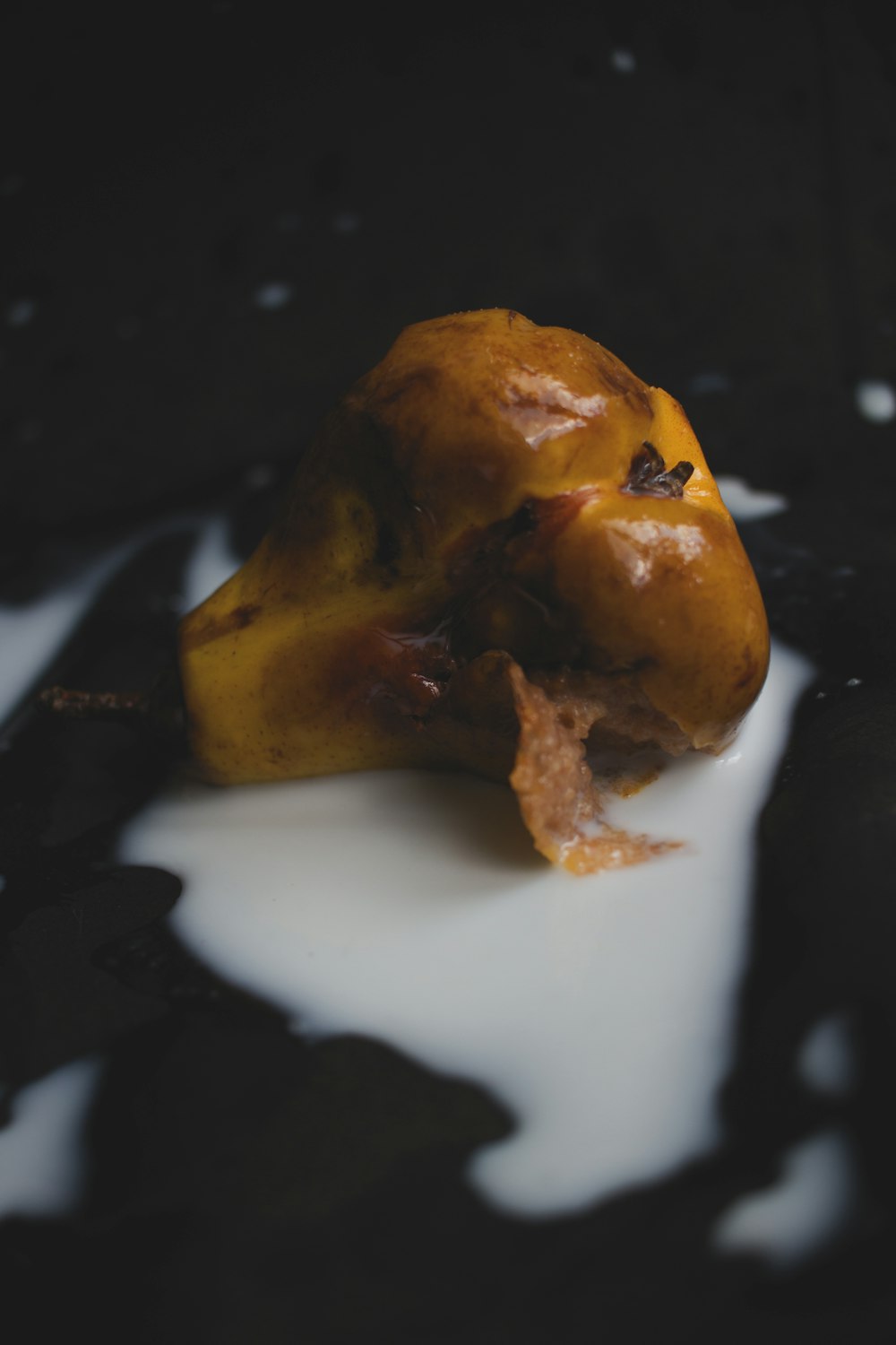 brown fruit on white ceramic plate