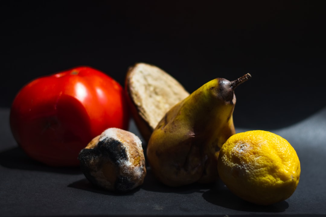 a group of fruits and vegetables sitting on a table, Rotten fruit 3