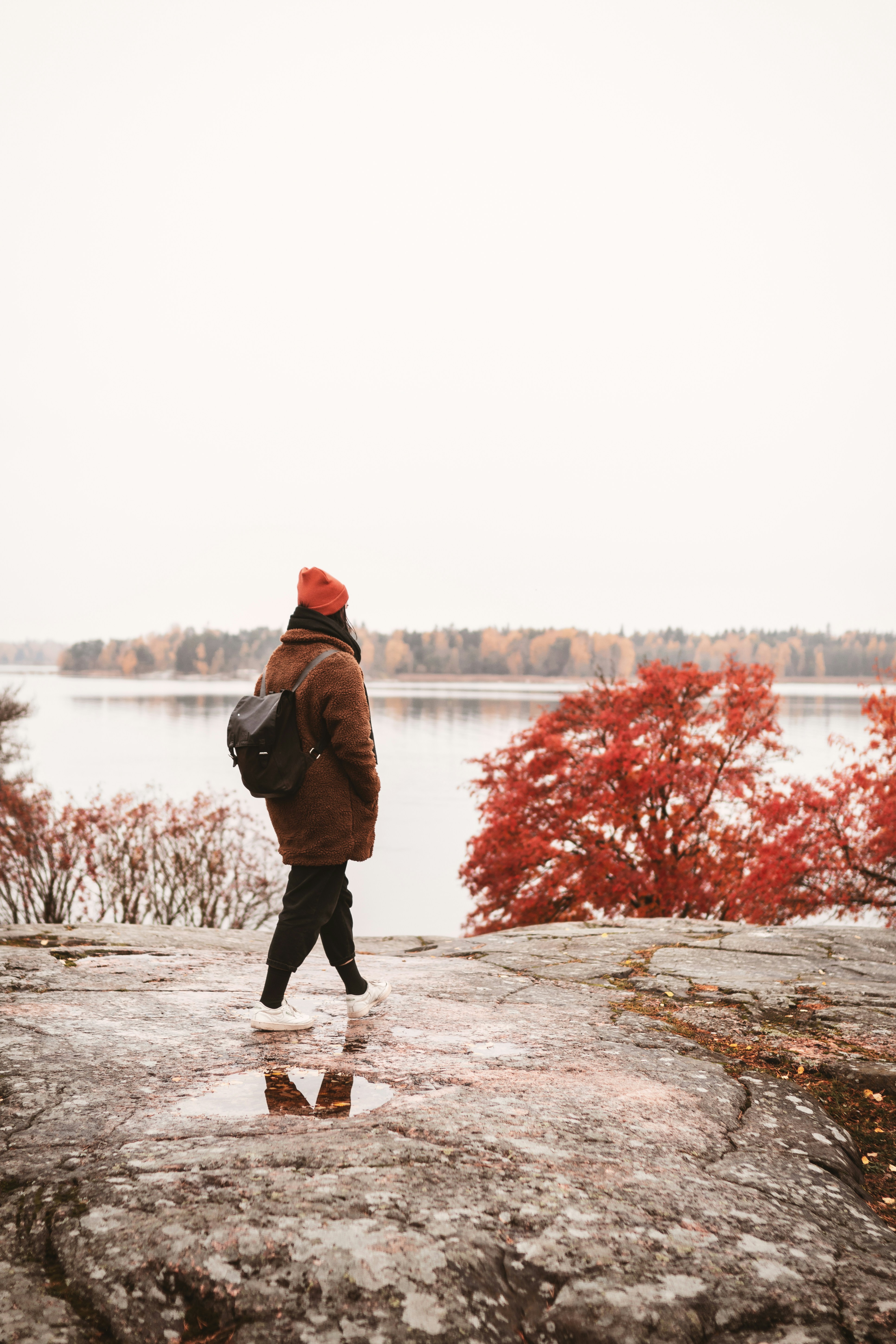 Walking by the sea in red perfect autumn