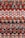 A colorful, tightly woven textile pattern composed of alternating bands of various fabrics. The materials are intricately interlaced, featuring warm hues like reds, oranges, and pinks with accents of teal and black. The texture appears rich and tactile, indicative of handcrafted artistry.