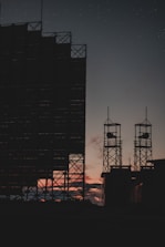 silhouette of tower during night time