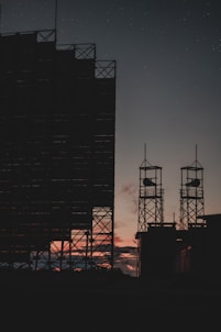 silhouette of tower during night time