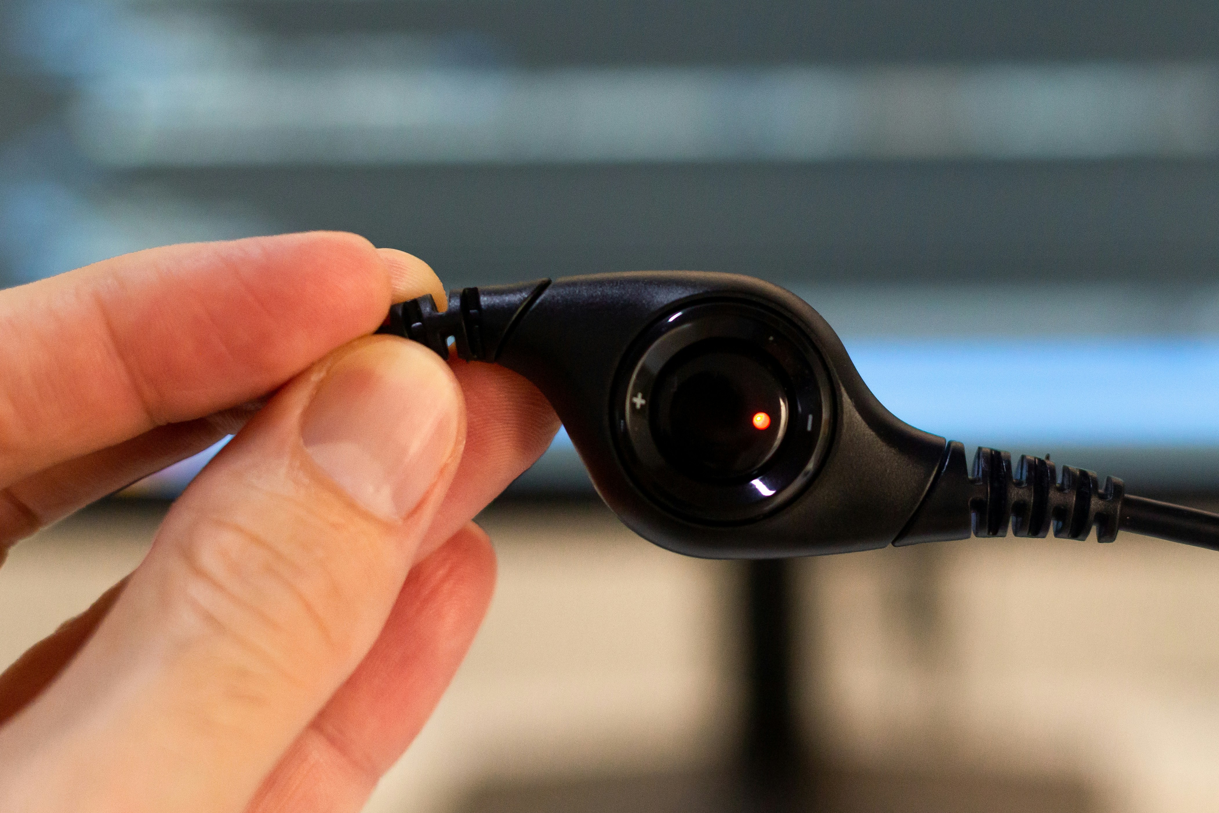 person holding black camera lens