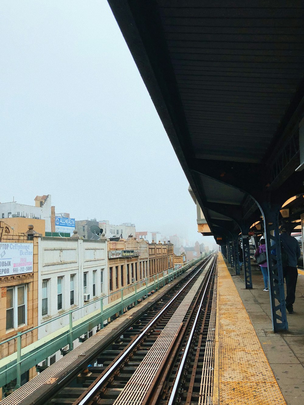 people walking on train station during daytime