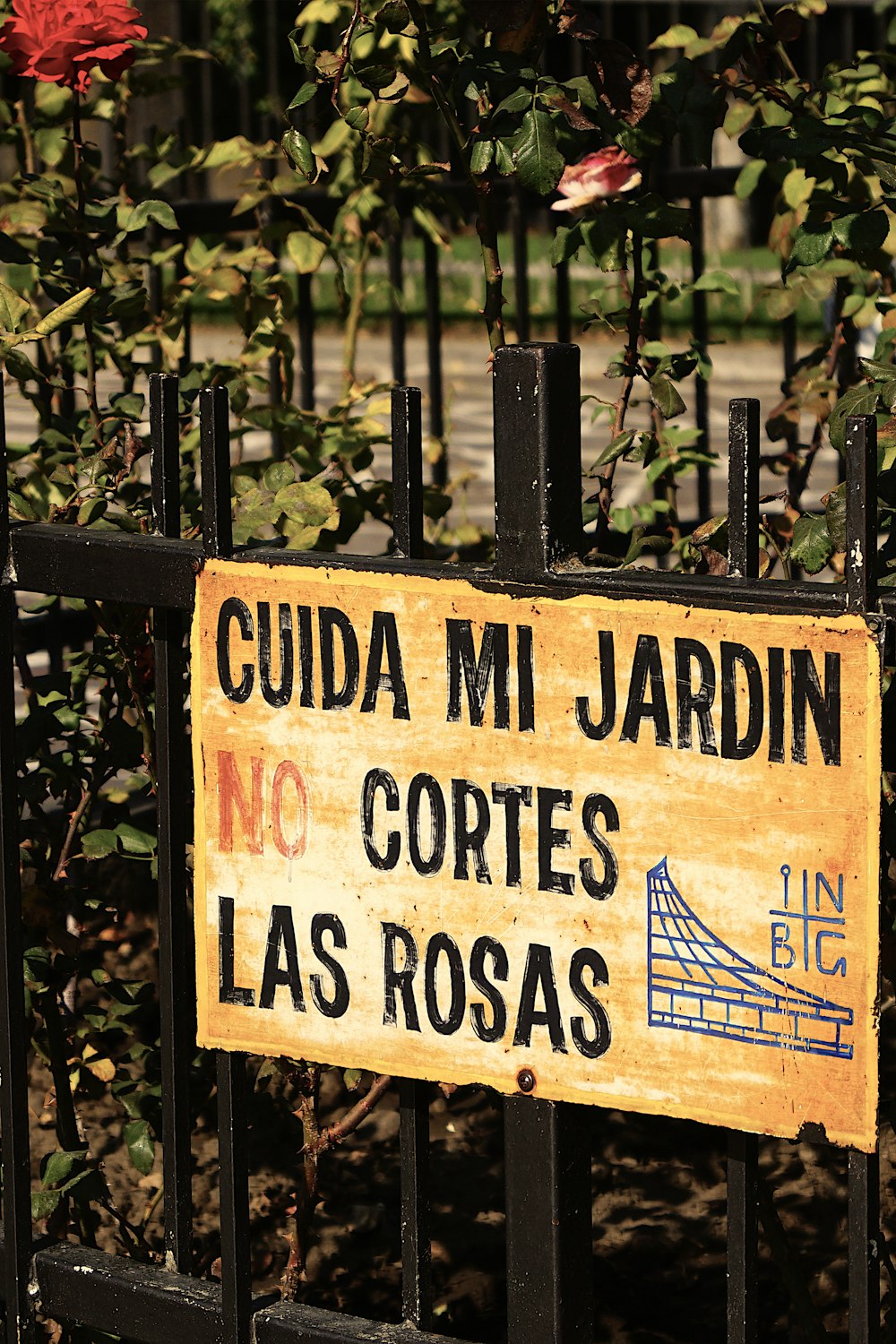 brown wooden signage on green plants