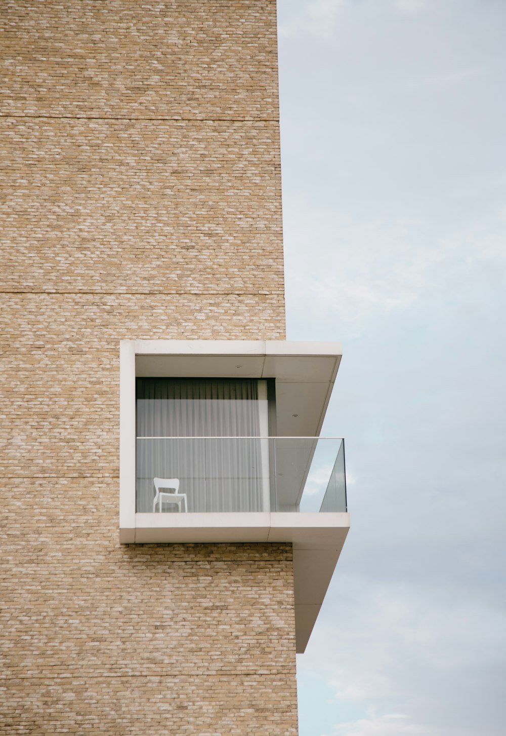 white and brown concrete building under white sky during daytime