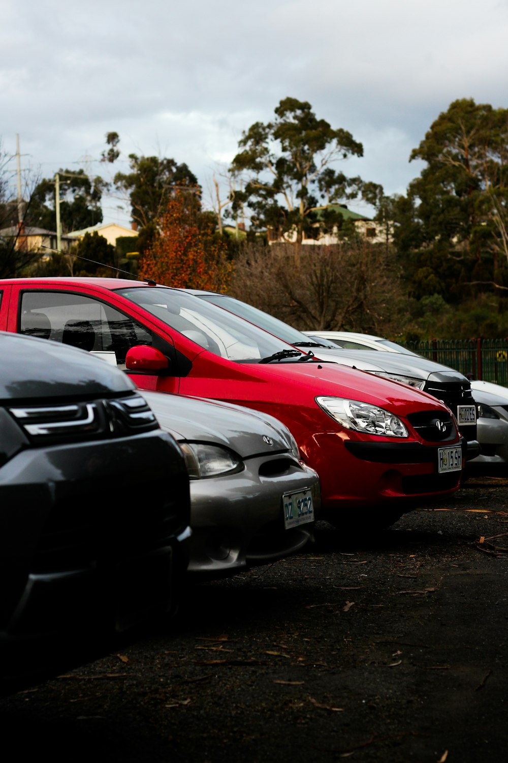 a row of parked cars in a parking lot