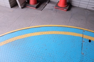 red plastic seat on white ceramic tiles