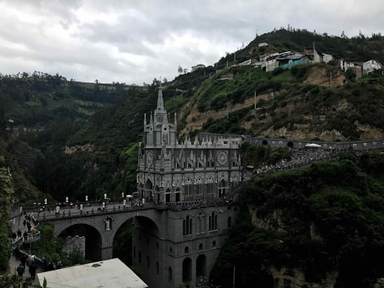 white concrete bridge over the river in Santuario Las Lajas Colombia