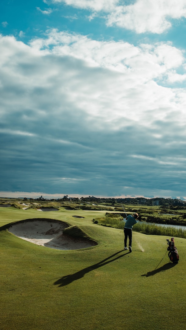 Golfer putting on green