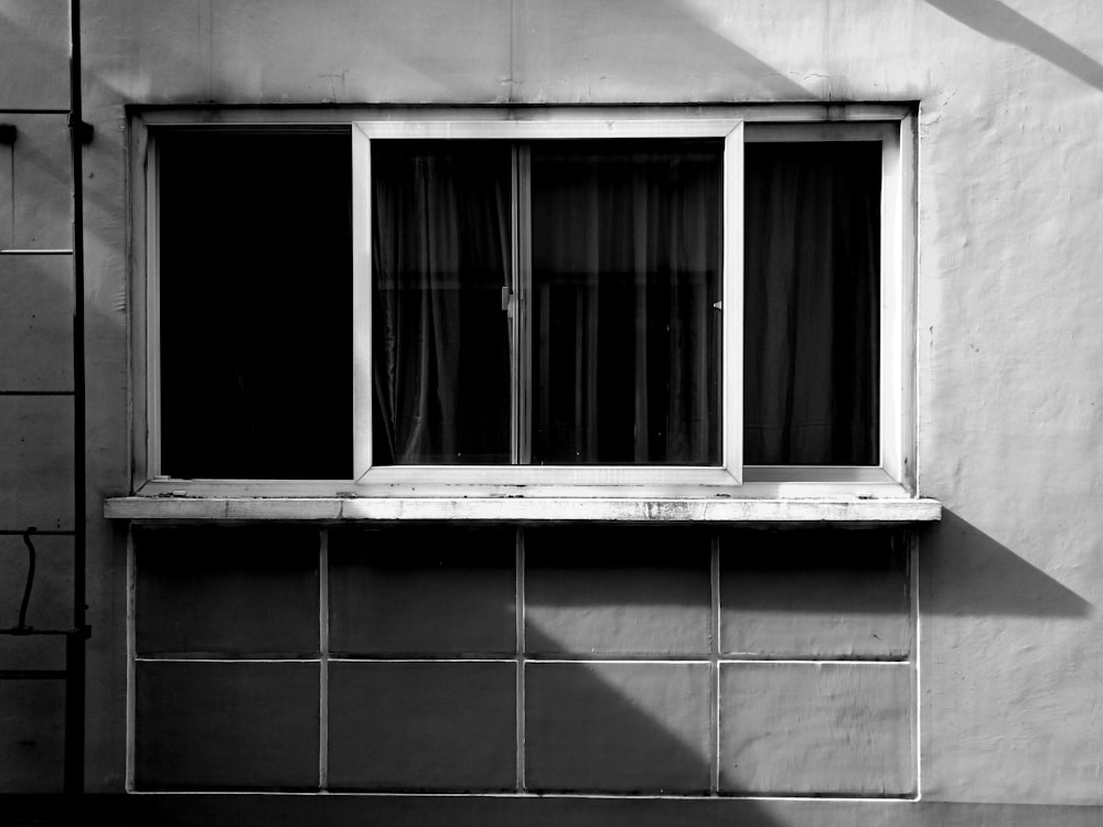 white wooden framed glass window