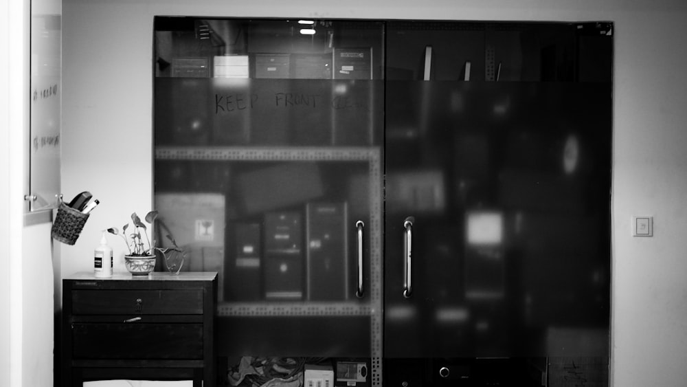 black and white photo of a black wooden shelf