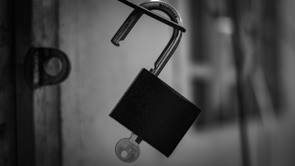 black and silver padlock in grayscale photography