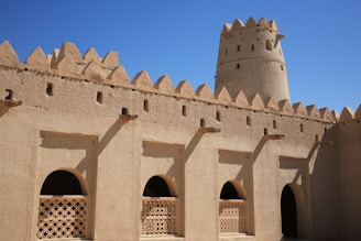 brown concrete building under blue sky during daytime