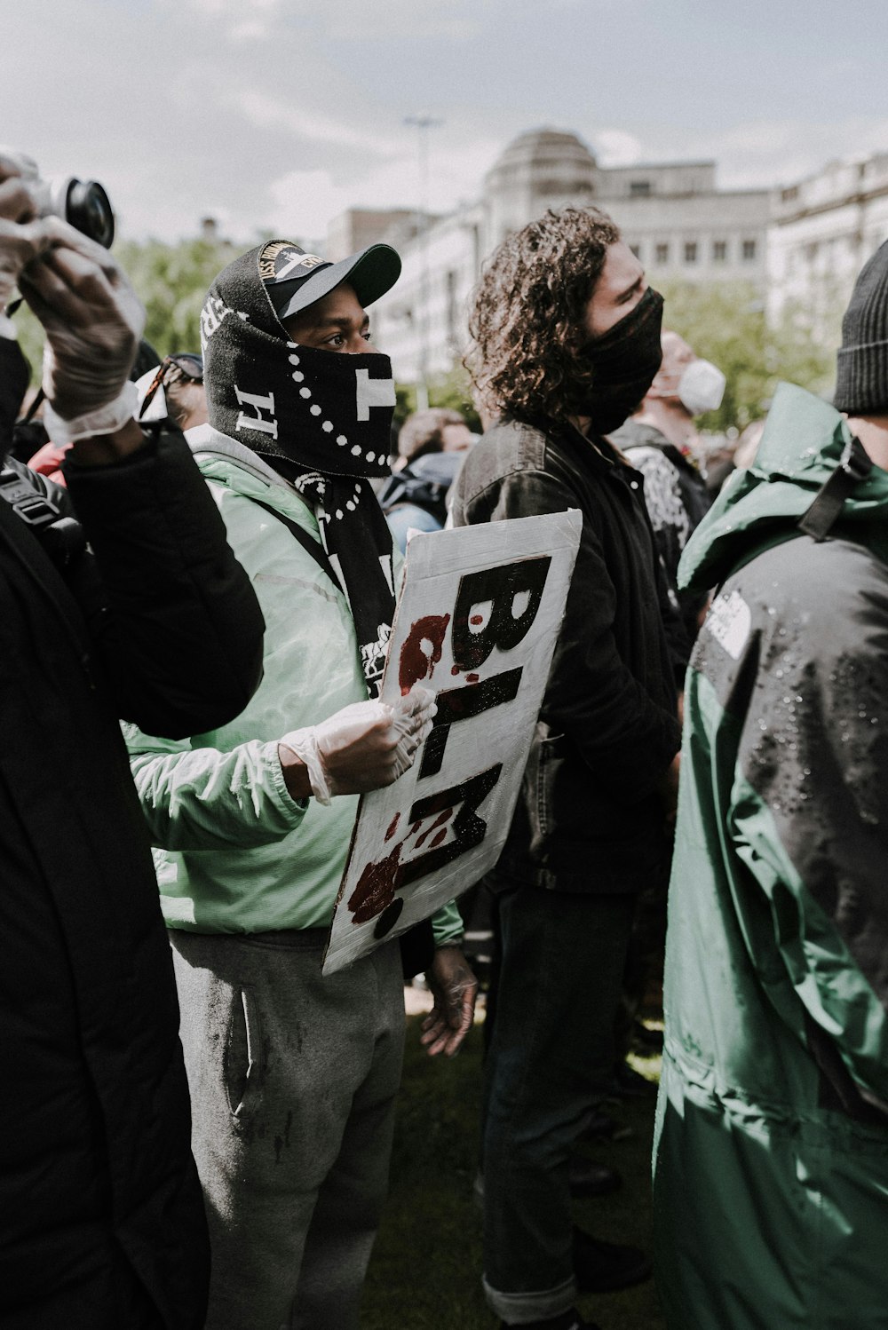 man in green jacket wearing white and black helmet