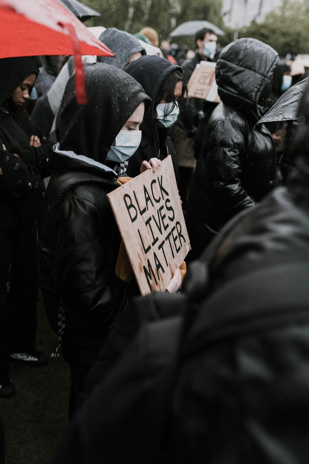 a group of people with black lives matter signs