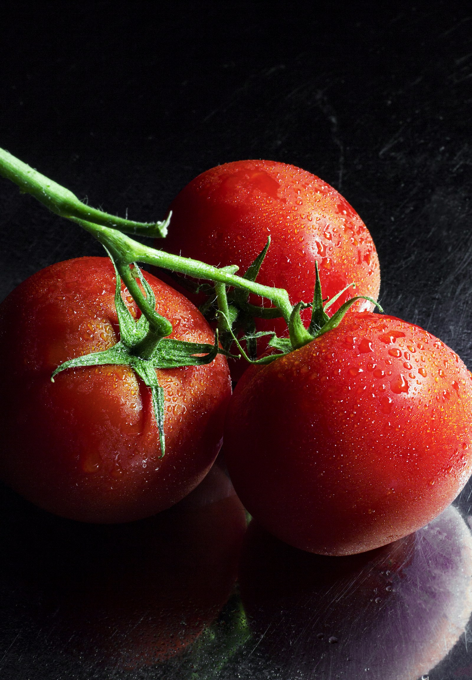 Sliced summer tomatoes with olive oil and basil
