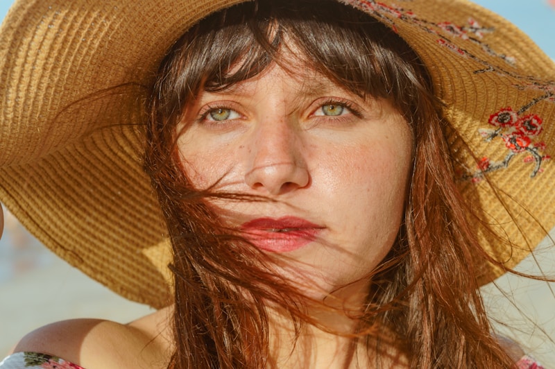 woman wearing brown sun hat