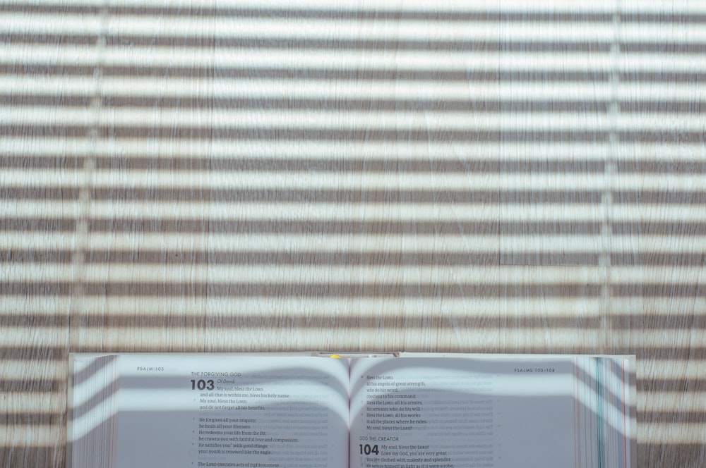 white book page on brown wooden table