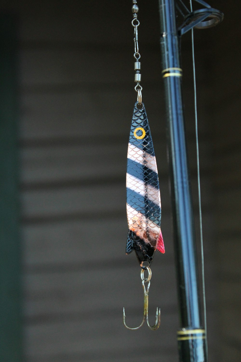 blue and white striped textile hanging on silver hook