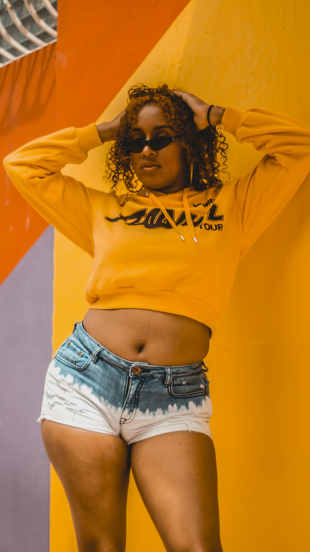 Woman in yellow long sleeve shirt and blue denim shorts photo – Free  Dominican republic Image on Unsplash