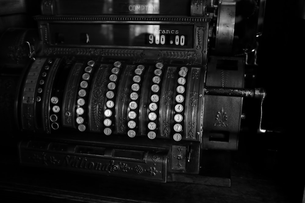 a black and white photo of an old typewriter