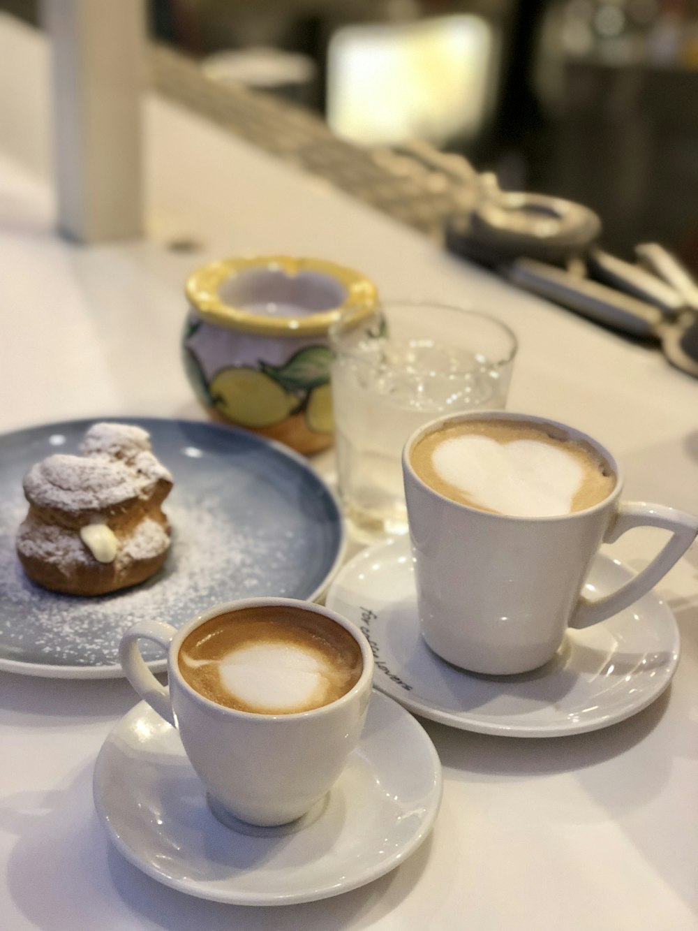 white ceramic cup on white ceramic saucer