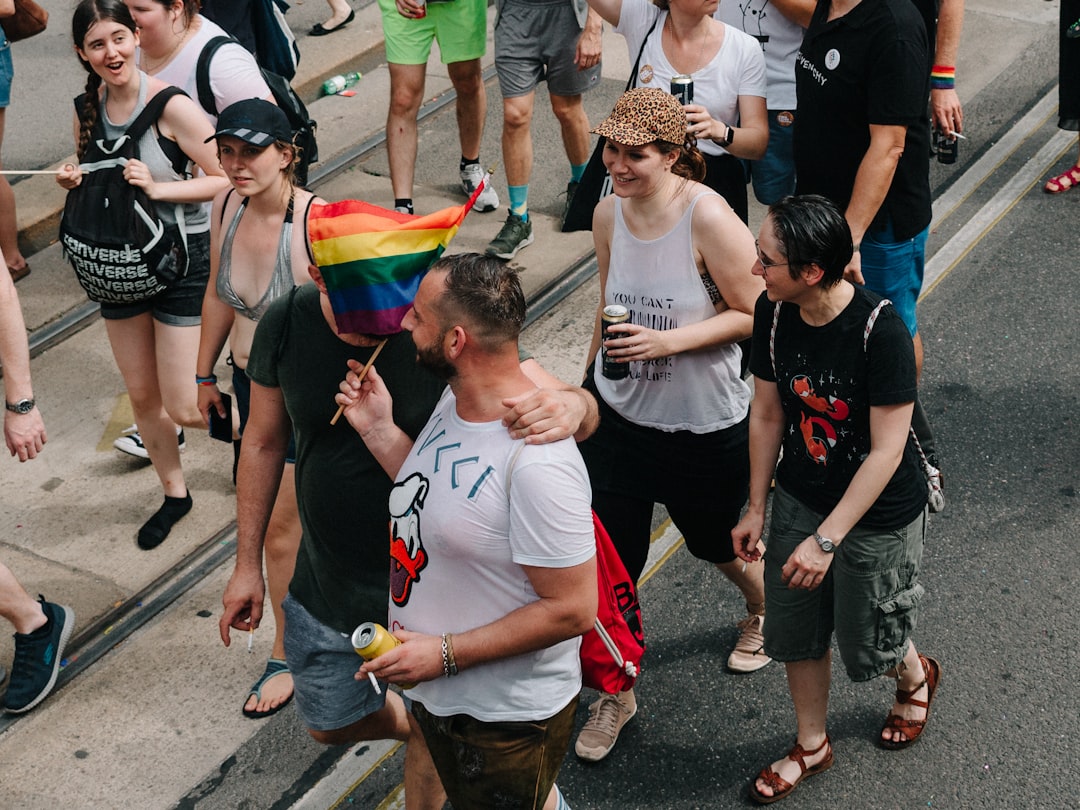 group of people standing on gray asphalt road during daytime, Pride in Vienna</p></figure><p>