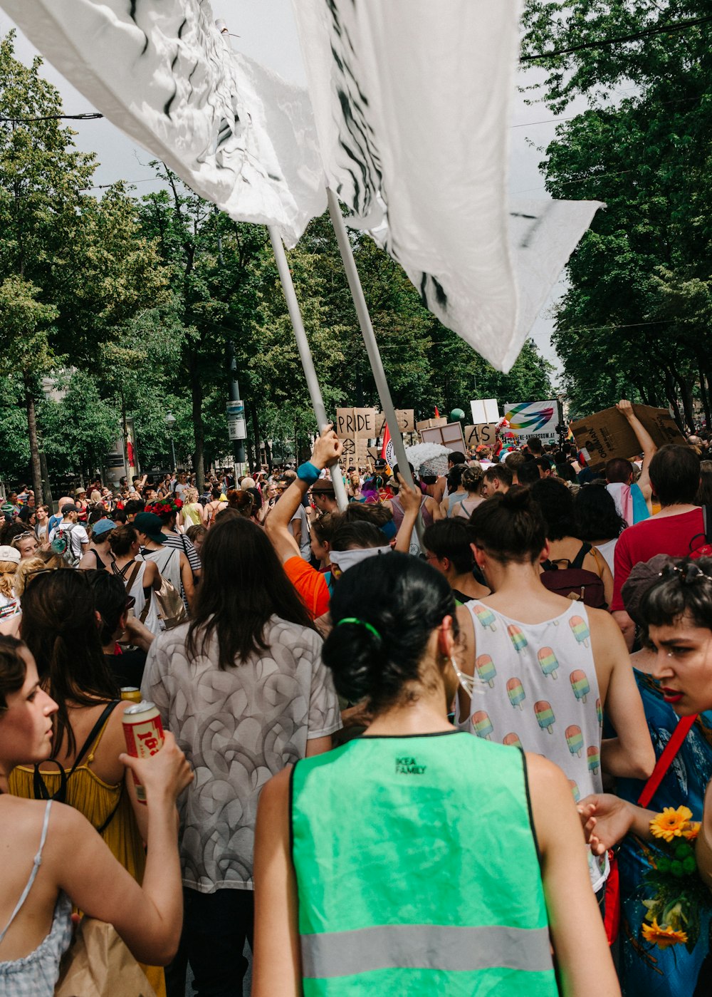 people gathering on a street during daytime