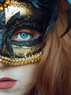 A close-up of a beautifully decorated carnival mask.