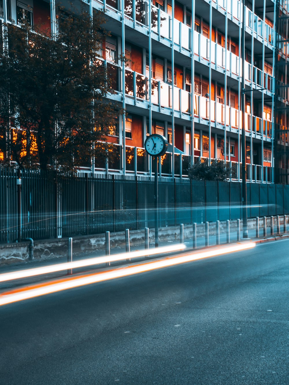 brown and white concrete building beside road during daytime