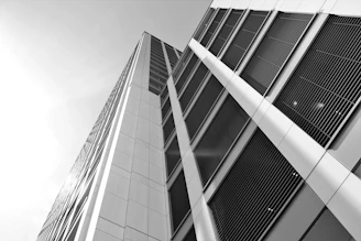 Ultra-realistic image of a modern high-rise building with sleek black and gold architectural accents