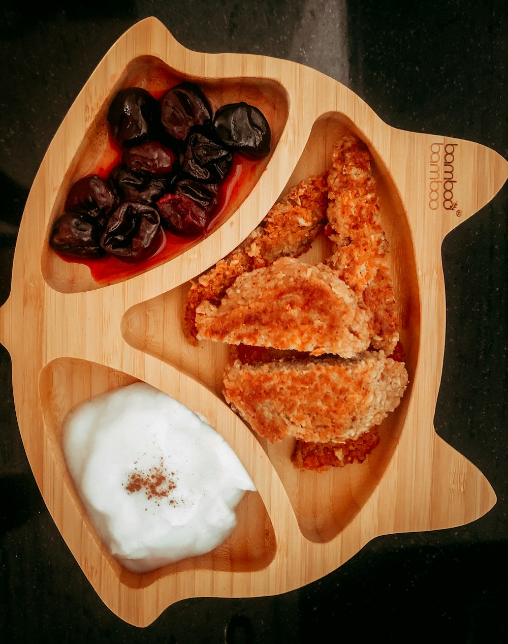 brown bread with white cream on brown wooden chopping board