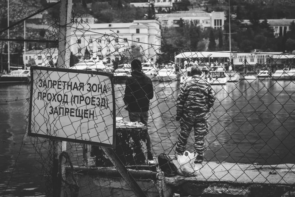 grayscale photo of people walking on street