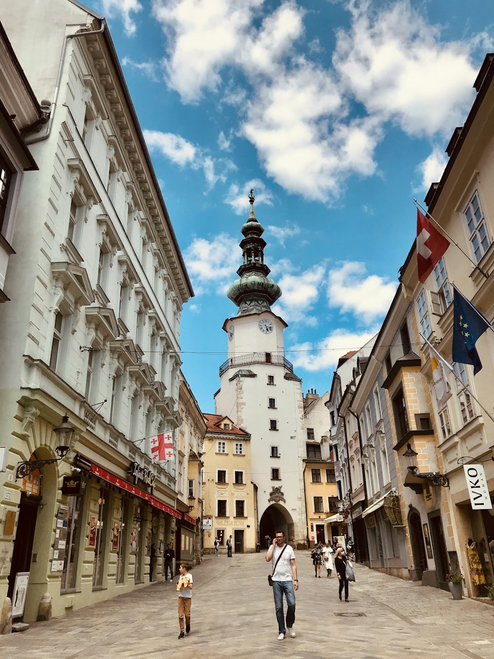 people walking on street near buildings during daytime