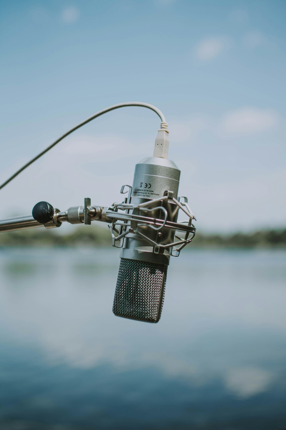 black and silver microphone with stand