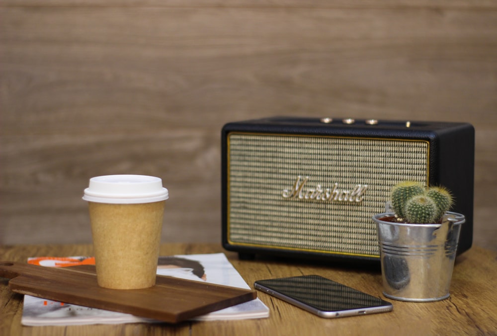 black and white coffee cup on brown wooden table