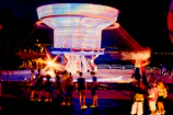 Guests enjoying a 360 spinner platform capturing dynamic 360-degree videos at a lively event.