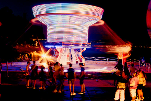 Guests enjoying a 360 spinner platform capturing dynamic 360-degree videos at a lively event.