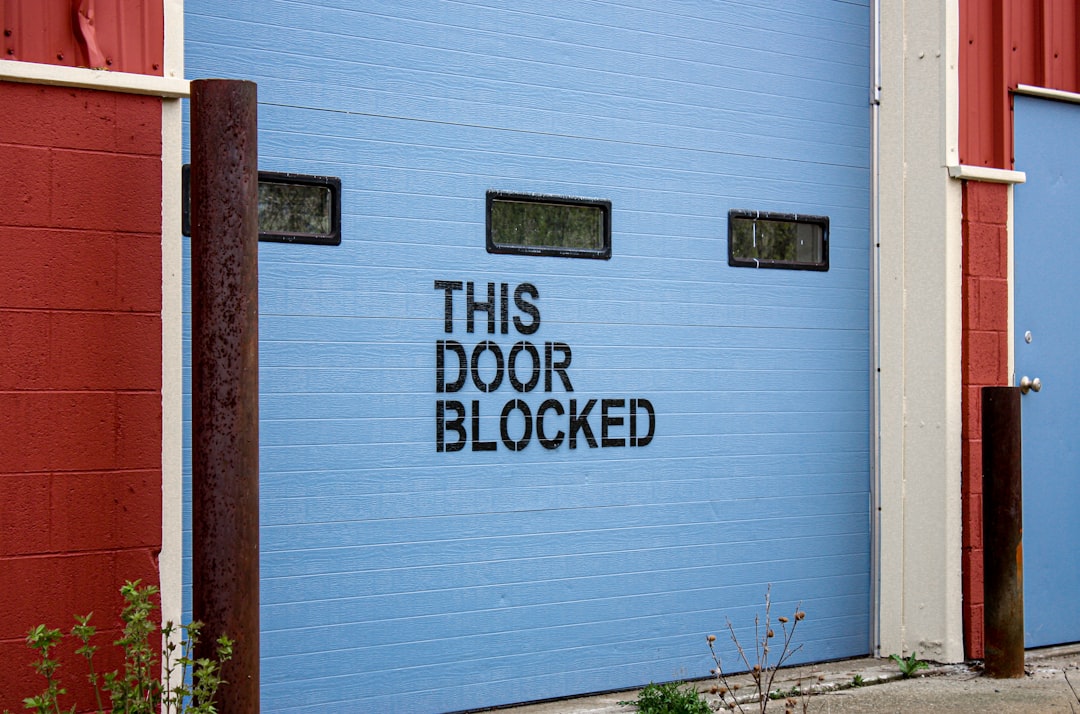 This door blocked sign on a garage door
