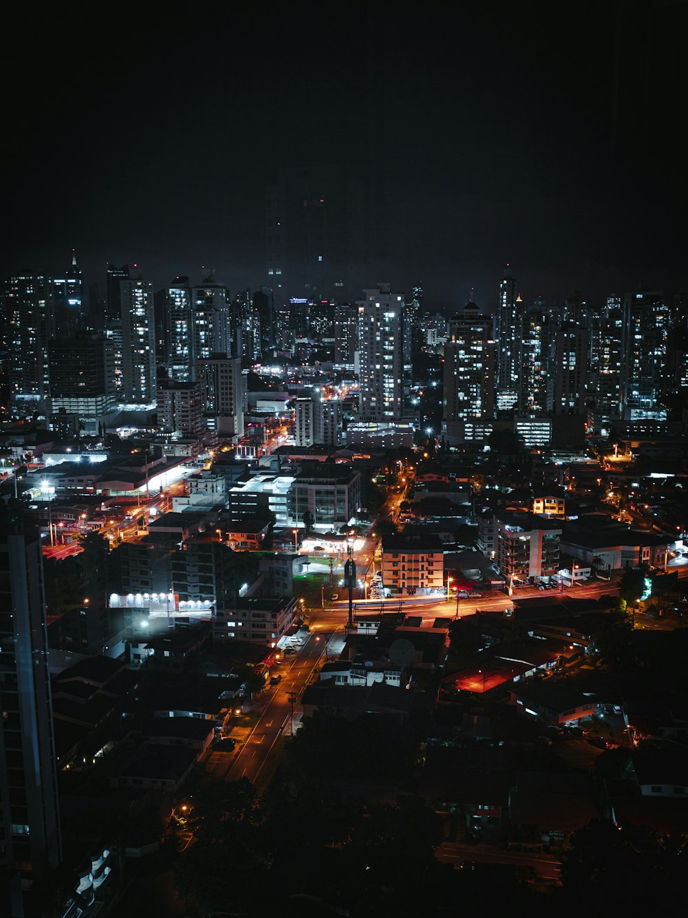 city with high rise buildings during night time