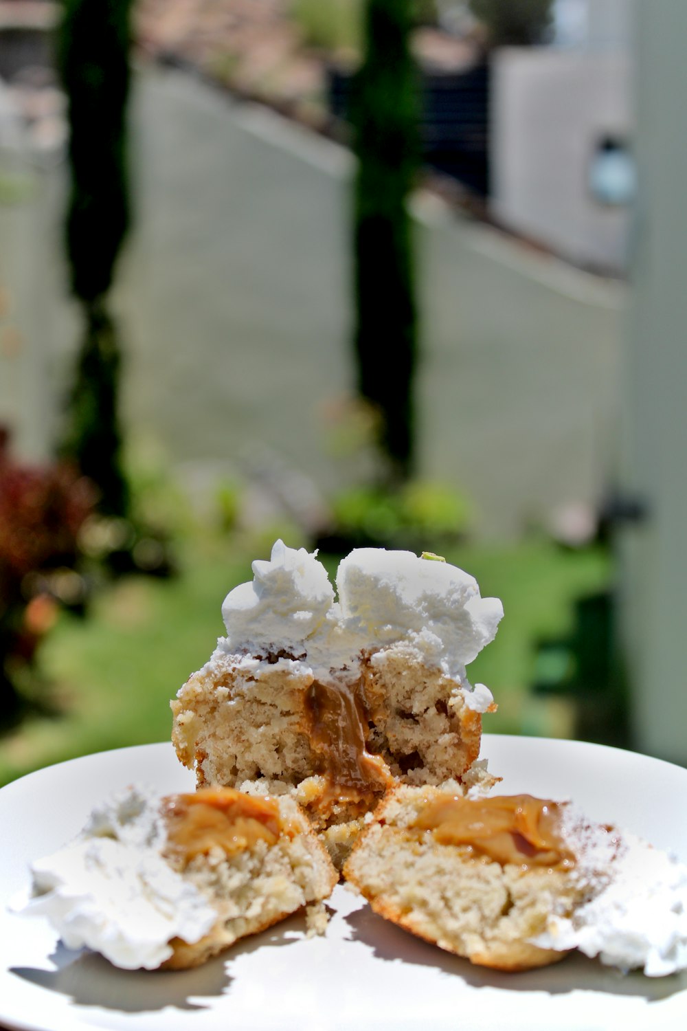 white icing covered cake on white ceramic plate