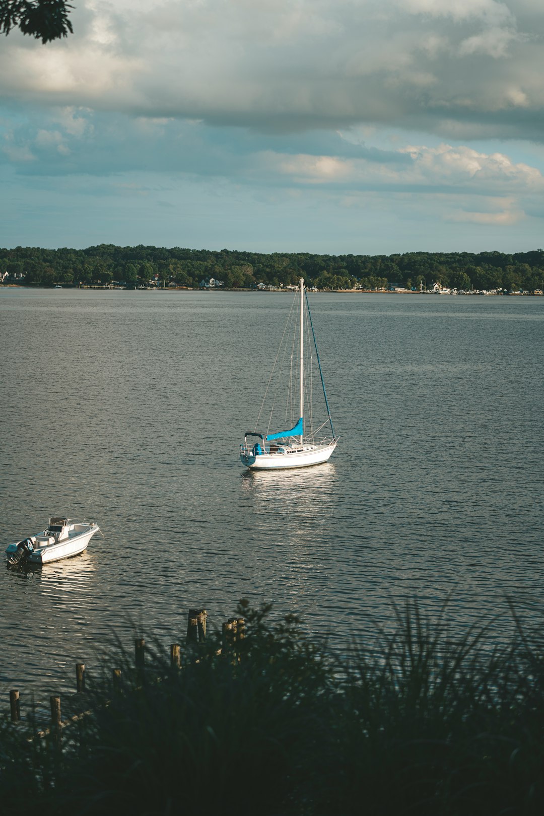 white and blue boat on water during daytime