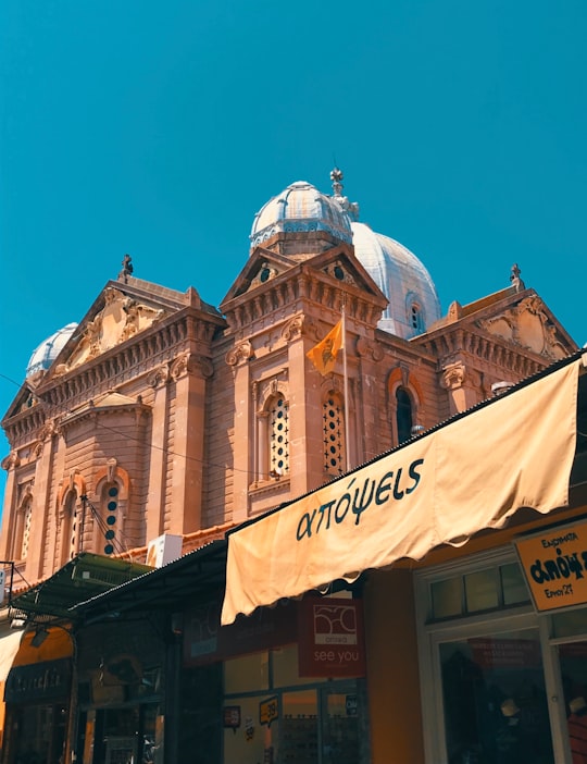 brown concrete building under blue sky during daytime in Lesbos Greece